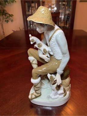 Porcelain Figurine of boy with hat holding goat petting dog beautiful piece